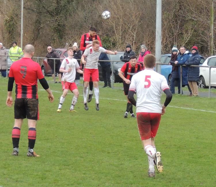 James Bryan wins a header - Picture Bill Carne