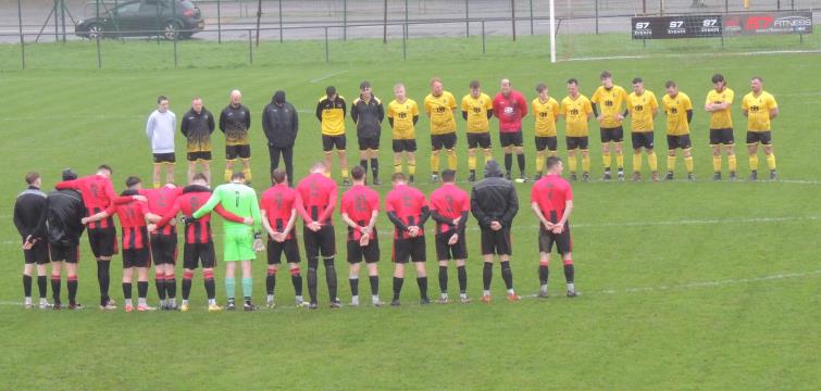 Before kick off Goodwick United and Herbrandston observe a minutes silence for Reg Owens. Picture Bill Carne