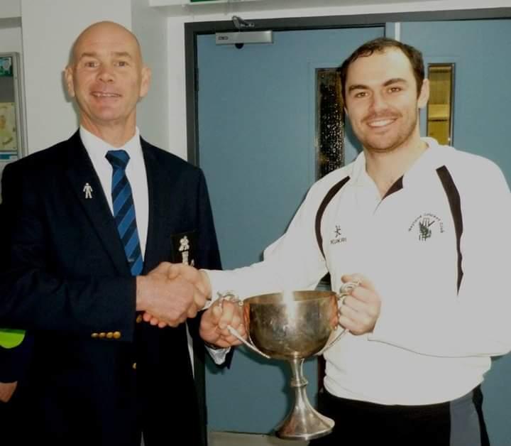 PCCC Chairman Paul Webb presents trophy to Neyland A skipper Sean Hannon