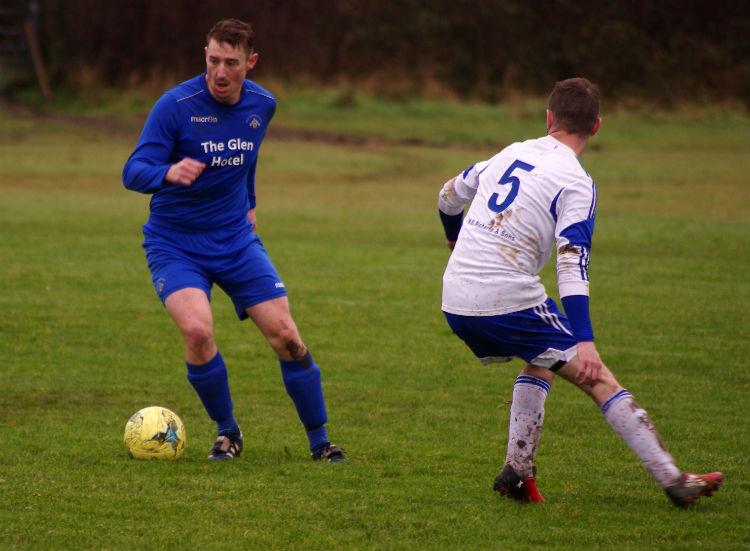 Ashley Beck pushes forward from midfield for Merlins Bridge against Angle