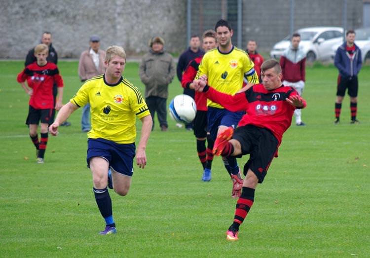 Carl Rees has a shot at goal for Pennar Robins in their convincing eight-goal victory against West Dragons