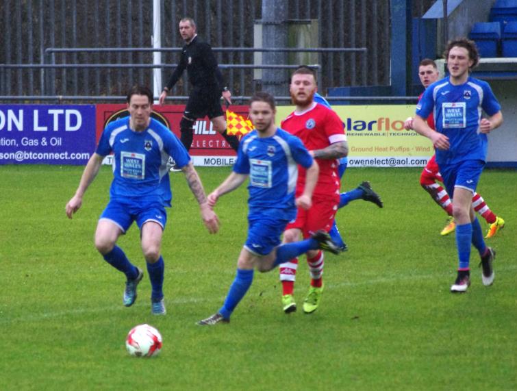 Haverfordwest County midfielders Kieran OBrien, Steffan Williams, Greg Walters hunt for possession
