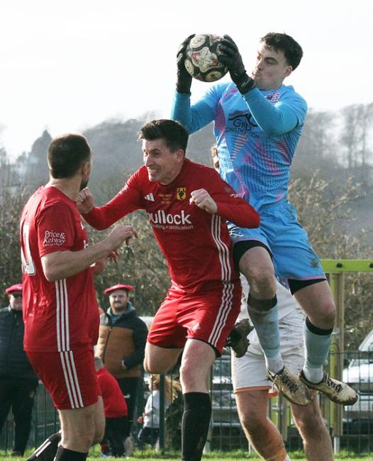 Nick Jones cleanly takes a cross for Goodwick United at Carew
