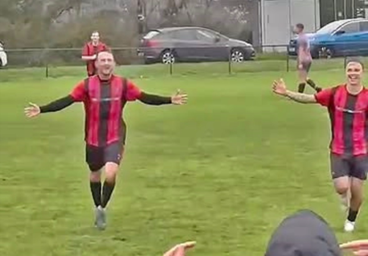 Two-goal Goodwick heroes Ben Steele and Will Haworth celebrate victory against Tenby in awful weather