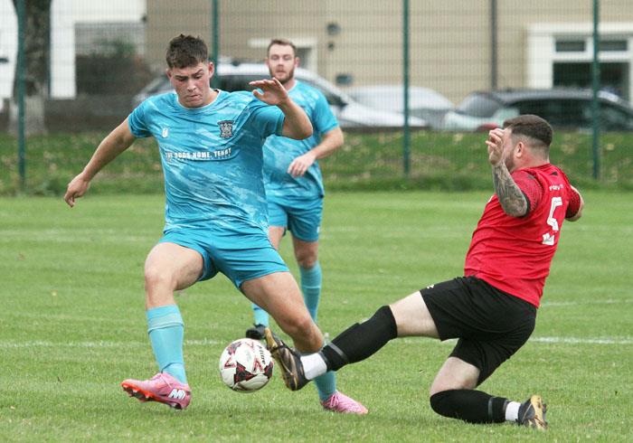 Connor Roberts puts in a strong tackle for Pennar Robins against Tenby. Picture Susan McKehon