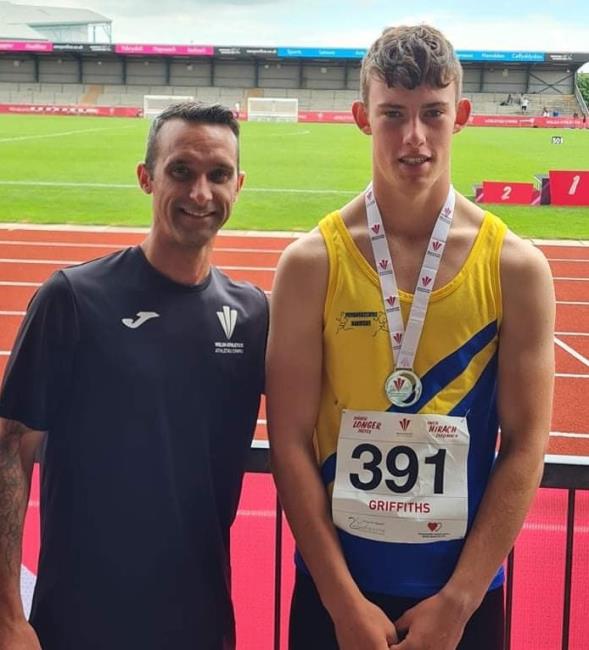 Wayne with Iolo Griffiths, silver medalist in both long jump and triple jump 