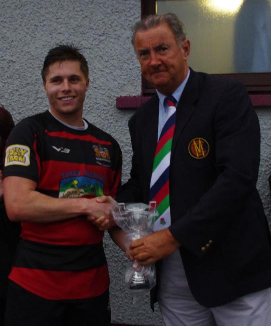 Ashley Sutton receives man of match trophy from Huw Hughes